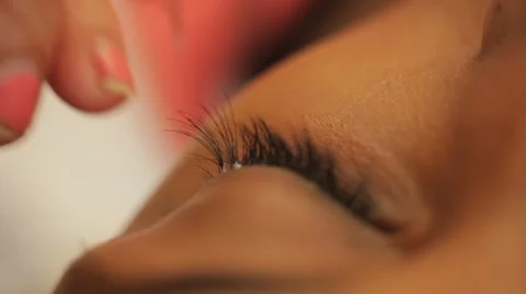 Glue and paint eyelashes Stock Footage 44440810