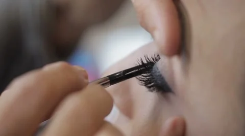 Glue and paint eyelashes Stock Footage 44824838