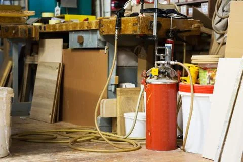 Glue gun with pump or compressor at workshop Stock Photos