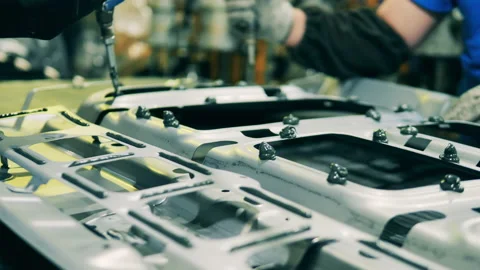 Glue paste is getting poured onto a metal automotive part Vídeo Stock 146511874