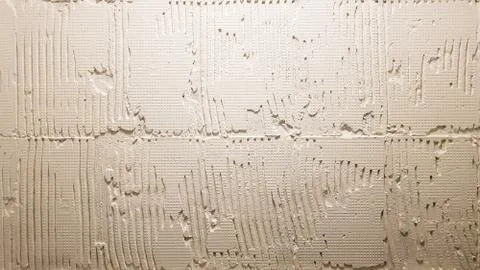 Glue for a tile with a gear pattern. Installation of tiles. The surface of th Foto stock