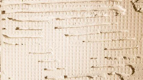 Glue for a tile with a gear pattern. Installation of tiles. The surface of th Foto stock