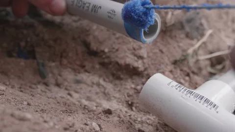 Glueing Conduit Pipe Together Stock Footage 164450254