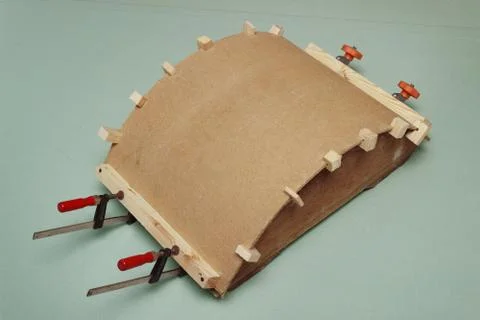 Gluing the arch of hardboard with the use of  forms Stock Photos