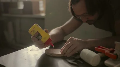 Gluing boards in a carpentry workshop. Connecting with dowels and glue. Producti Stock Footage 219347129