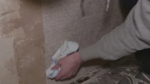 Gluing wallpaper rolls vinyl preparing the surface walls apartment renovation 스톡 동영상 148397388