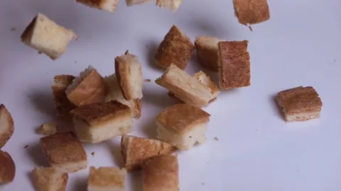 Gluten Free Bread Cubes Falling on white surface, Slow Motion 1000fps Stock Footage 149109788