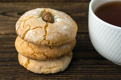 Gluten free italian cookies and a cup of tea. Almond cookies and a cup of tea Stock Photos