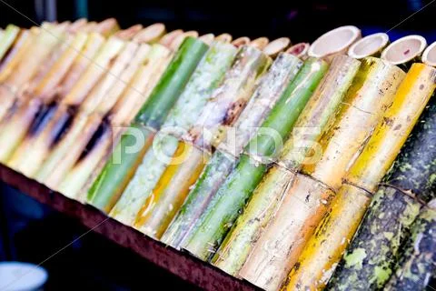 Glutinous rice roasted in bamboo joints Stock Photos