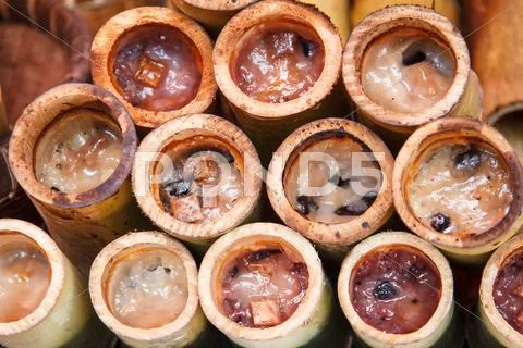 Glutinous rice roasted in bamboo joints Stock Photos