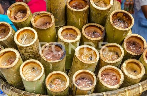 Glutinous rice roasted in bamboo joints (khoalam) Stock Photos