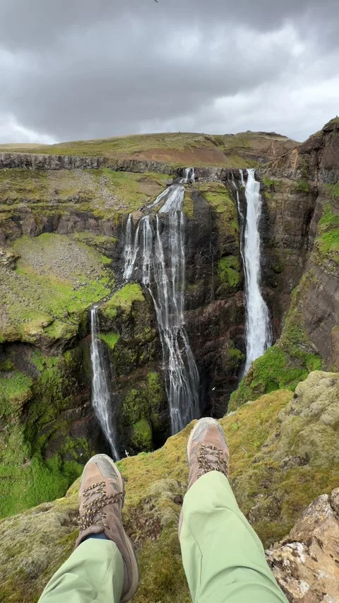 Glymur Waterfall plunges into a deep moss-covered canyon in Hvalfjörður, Iceland Stock Footage 312232973