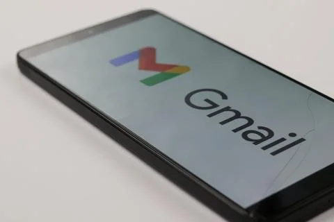 Gmail logo on a smartphone isolated on white Stock Photos
