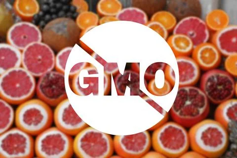 GMO free products. Blurred view of fresh ripe fruits on counter at wholesale  Stock Photos