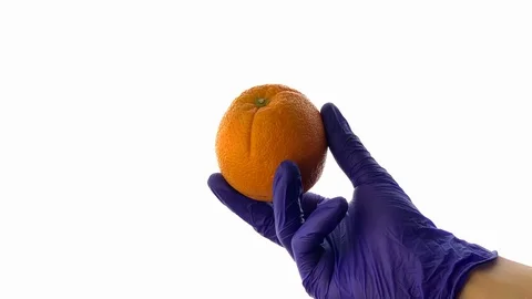 GMO.  White background. Vegetables of the future. Scientist showed fruit Stock-Footage 116097354
