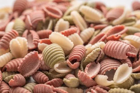 Gnocchetti multicolored pasta background concept. Diet and healthy food concept Stock Photos