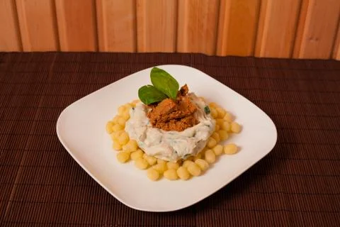 Gnocchi and spinach. Stock Photos
