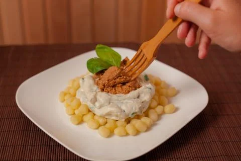 Gnocchi and spinach. Stock Photos