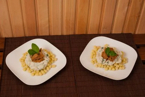 Gnocchi and spinach. Stock Photos