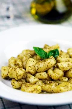 Gnocchi with basil pesto Stock Photos