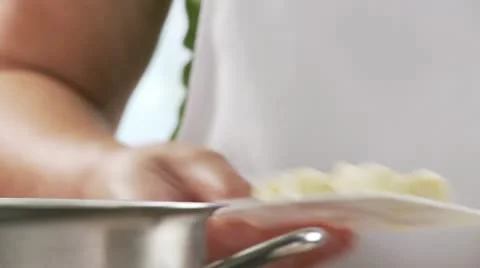 Gnocchi being added to salt water Stock Footage 24643770