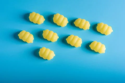 Gnocchi pasta pattern on a blue background Stock Photos
