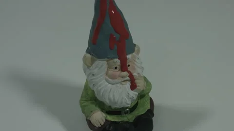 Gnome Statue Gets Soaked In Blood Red Paint 4K Stock Footage 218632836