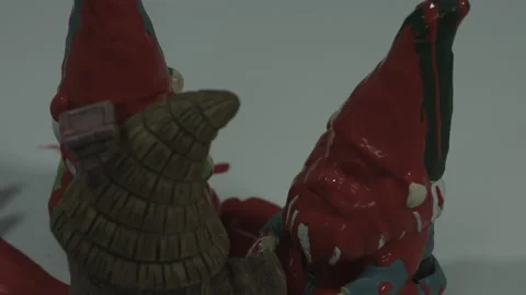 Gnome Statue Gets Soaked In Blood Red Paint 4K Stock Footage 218632882