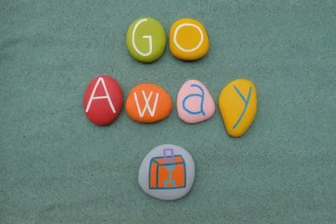 Go away text composed with multicolored stone letters and a luggage design Stock Photos