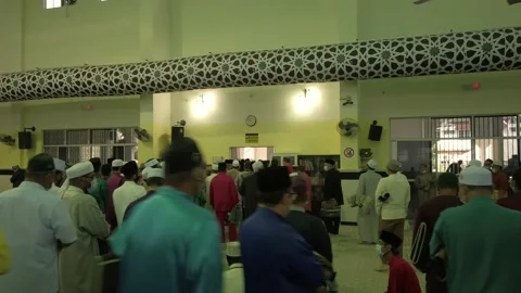 Go back from prayers Stock Footage 136393054