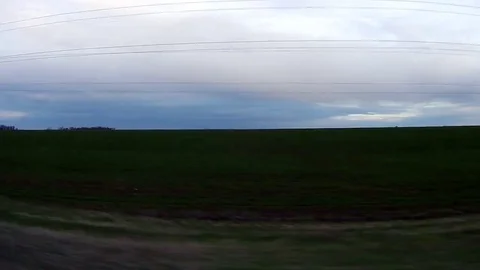 Go by car along the field Stock Footage 75897254