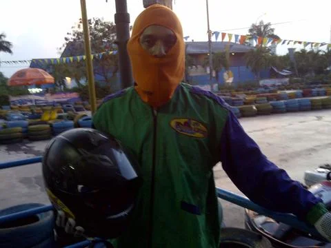 Go cart Driver is posing in front of the circuit at Jakarta in the sunny day Stock Photos