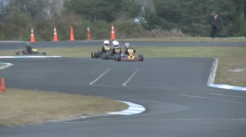 Go carts racing around a track Stock Footage 11489898