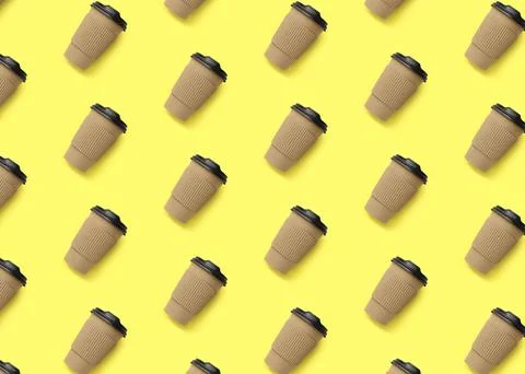 To-go drink. Pattern design with paper coffee cup on light yellow background Stock Photos