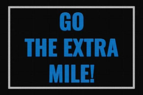 Go The Extra Mile text on dark screen Stock Photos