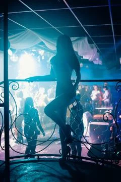 Go-go dancer posing on stage in a nightclub Stock Photos