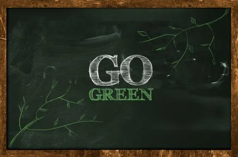 Go Green Text on blackboard Ilustración de archivo