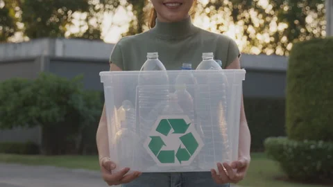 Go green together. Recyclable plastic bottle. Reduce plastic garbage. Stock Footage 248116643
