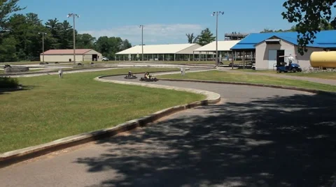 Go Karts weave slowly through track Stock Footage 64530893