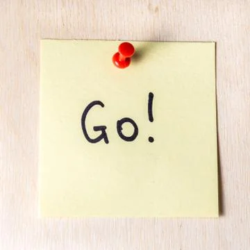 Go note on paper post it Fotos Stock