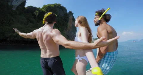 Go pro footage of young multi cultural gettin pumped up to jump off long tail bo Stock Footage 201093850