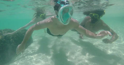 Go pro footage of young multi cultural friends swimming and snorkeling in tropic Stock Footage 201096251