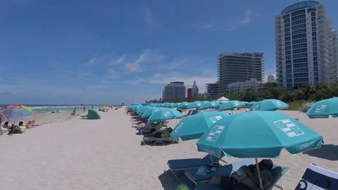 Go Pro pan of miami beach hotels and umbrellas summer 库存影片 79975907