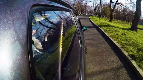 Go Pro shot of driving a car through town. Front view from the back Stock Footage 107598415