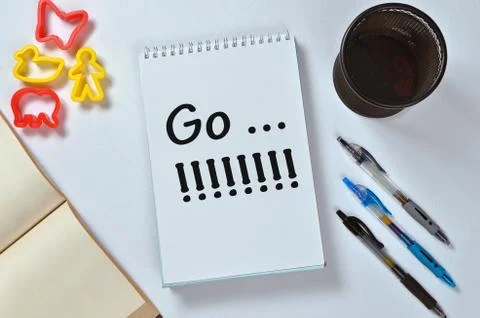 Go...!!!!!! text on notepad with office accessories. Business motivation, ins Stock Photos