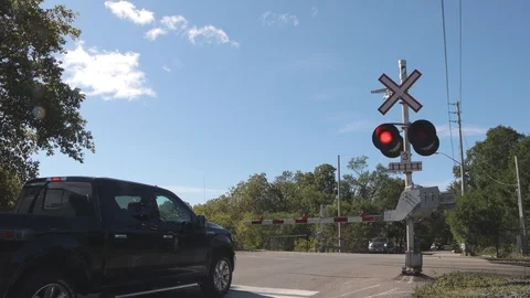 GO Train commuter train passing at level railway crossing Stock Footage 117258559