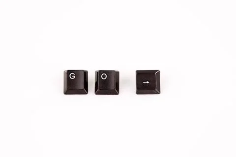 Go word written with black computer buttons on white background Stock Photos