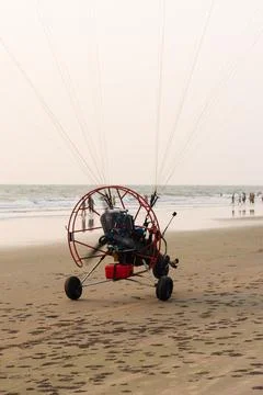 GOA, INDIA - Apr 02, 2021: Motorised paragliding activities at Ashvem beach 写真素材