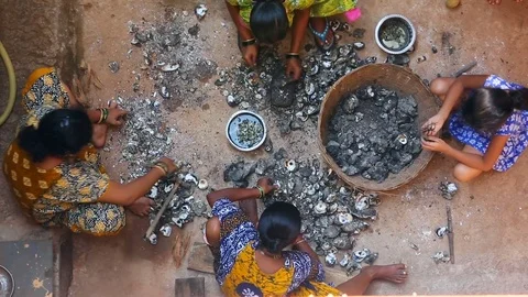 GOA, India  DEC, 2016: Indian Womens cleaning mussels after fishing. Stock Footage 74674385