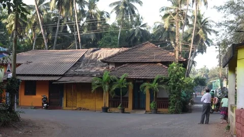 Goa An Very Old House Side Of The Road And Local People Walking On Road. Stock Footage 305035527